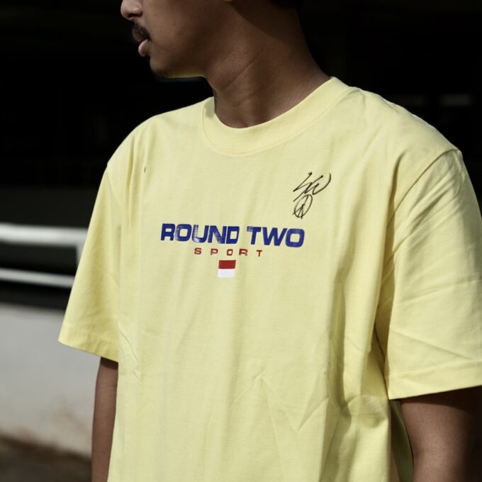 Round Two x USS Merch Tee Sean Wotherspoon With Sign Yellow